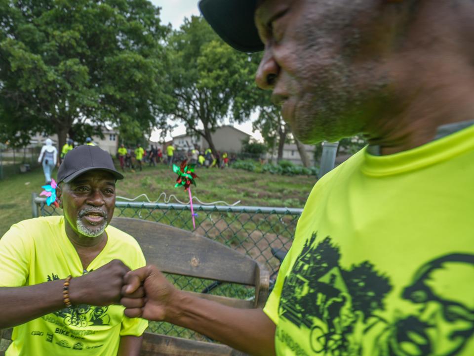 Andre Lee Ellis, left, and a friend who has become family, Thomas Harris, share a moment during Ellis' birthday party and bike giveaway Saturday, Aug. 13, 2022, at 1313 W. Reservoir Ave., Milwaukee. "Just wanted to wish him a happy birthday," he said.