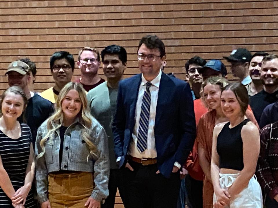 Charlie Kirk, founder of Turning Point USA, poses with students ahead of a speech at Gammage Auditorium on Feb. 8, 2023.