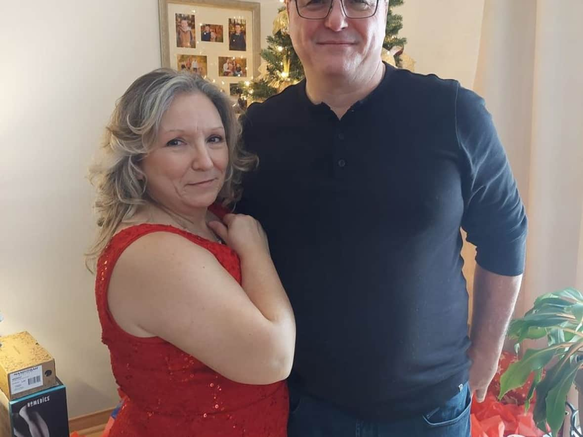 Josh Bastien says his father, Rick, right, died in Thursday's explosion and fire at Eastway Tank on Merivale Road in Ottawa, one of the deadliest industrial disasters in the city's history. Rick is pictured with his wife, Louise Martel. (Rick Bastien/Facebook - image credit)