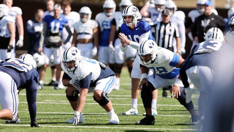 Quarterback Kedon Slovis calls the signals at the line as BYU practices in Provo on Friday, March 17, 2023.