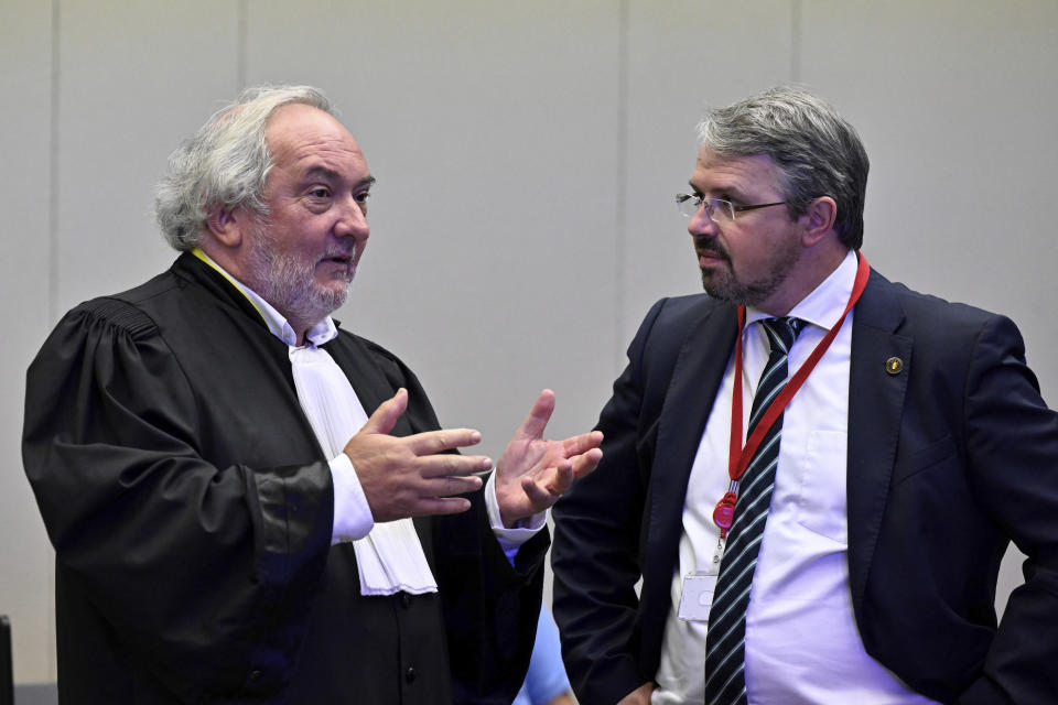 Lawyer Vincent Lurquin, left, speaks with Belgian Federal Prosecutor Frederic Van Leeuw prior to the reading of the sentences during the trial regarding the attacks at a Brussels metro station and the city's airport at the Justitia building in Brussels, Friday, Sept. 15, 2023. The morning rush hour attacks at Belgium's main airport and on the central commuter line took place on March 22, 2016, which killed 32 people, and nearly 900 others were wounded or suffered mental trauma. (John Thys, Pool Photo via AP)