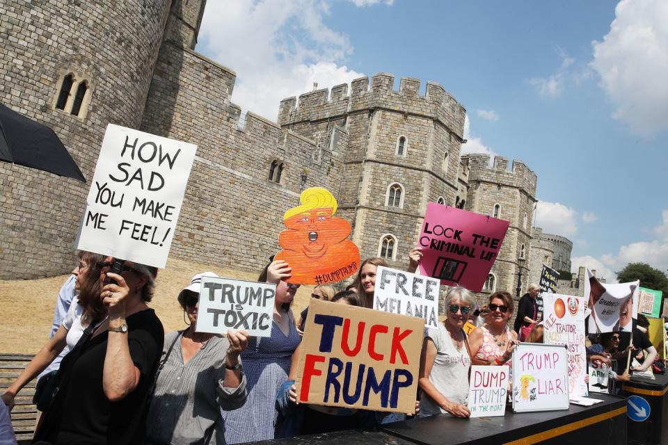 <p>Demonstrations against Trump's visit have been taking place across the UK. Here are a few protestors outside Windsor Castle.</p>