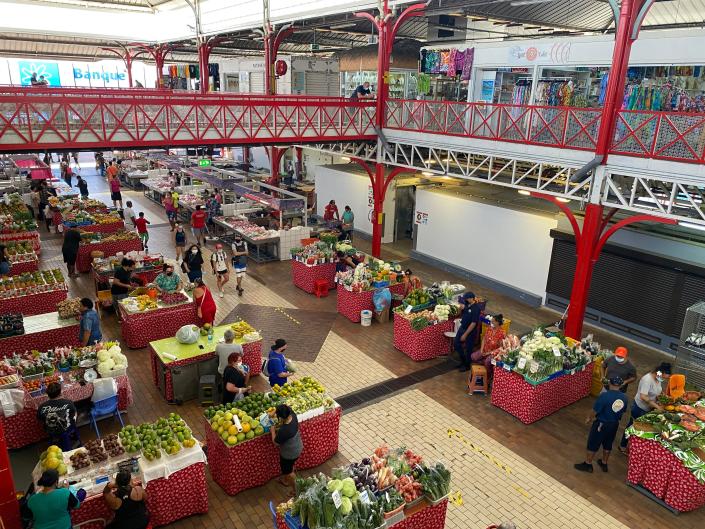 An indoor market displaying fresh produce.