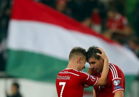 Hungary's Daniel Bode (R) and Balazs Dzsudzsak celebrate their victory against Faroe Islands in their Euro 2016 qualifying soccer match in Budapes, Hungary October 8, 2015. REUTERS/Laszlo Balogh