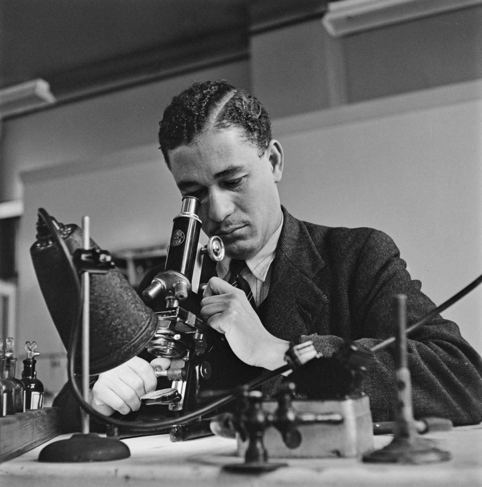 A scientist examines a sample with a microscope London, UK, 1948. (Keystone Features/Hulton Archive/Getty Images)