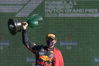 Red Bull driver Max Verstappen of the Netherlands celebrates on the podium after winning the Formula One Dutch Grand Prix, at the Zandvoort racetrack, Netherlands, Sunday, Sept. 5, 2021. (AP Photo/Peter Dejong)