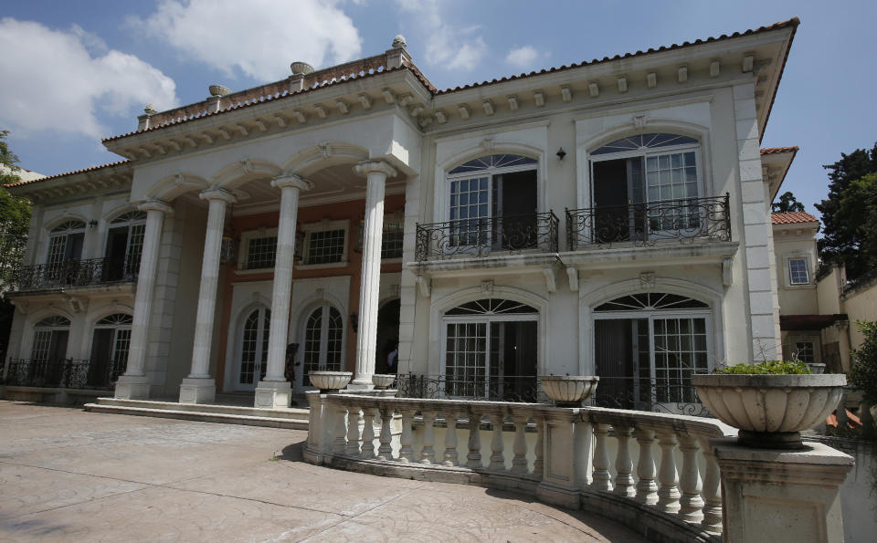 CORRECTS DAY OF WEEK - The mansion of Chinese-Mexican businessman Zhenli Ye Gon during a media tour in Mexico City, Tuesday, July 30, 2019. The federal government said Monday it will hold an Aug. 11 auction for the Mexico City mansion worth $5 million (95 million Mexican pesos) that previously belonged to the suspected drug trafficker. (AP Photo/Ginnette Riquelme)