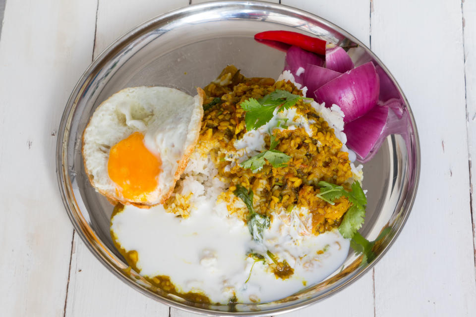 Nepalese curry over rice with an egg.