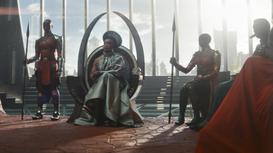 (L-R): Dorothy Steel as Merchant Tribe Elder, Florence Kasumba as Ayo, Angela Bassett as Ramonda, Danai Gurira as Okoye in Marvel Studios' Black Panther: Wakanda Forever. Photo courtesy of Marvel Studios. © 2022 MARVEL.