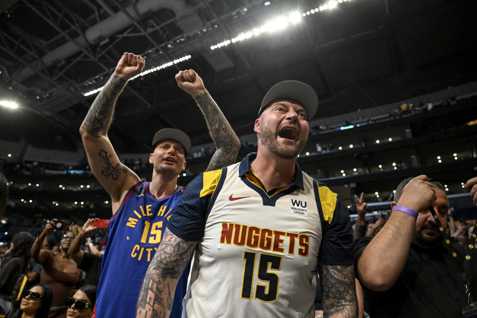 Nemanja and Strahinja Jokić, brothers of Nikola Jokić celebrate courtside after the Nuggets' win over the Lakers in Game 4 of the Western Conference finals in 2023.