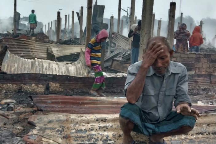 A Rohingya man reacts after a fire at the Nayapara refugee camp in Cox's Bazar