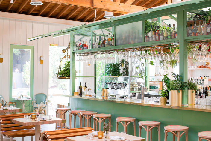 The sage-tinted bar is situated in a greenhouse-like structure at The Butcher’s Daughter’s new West Hollywood location.