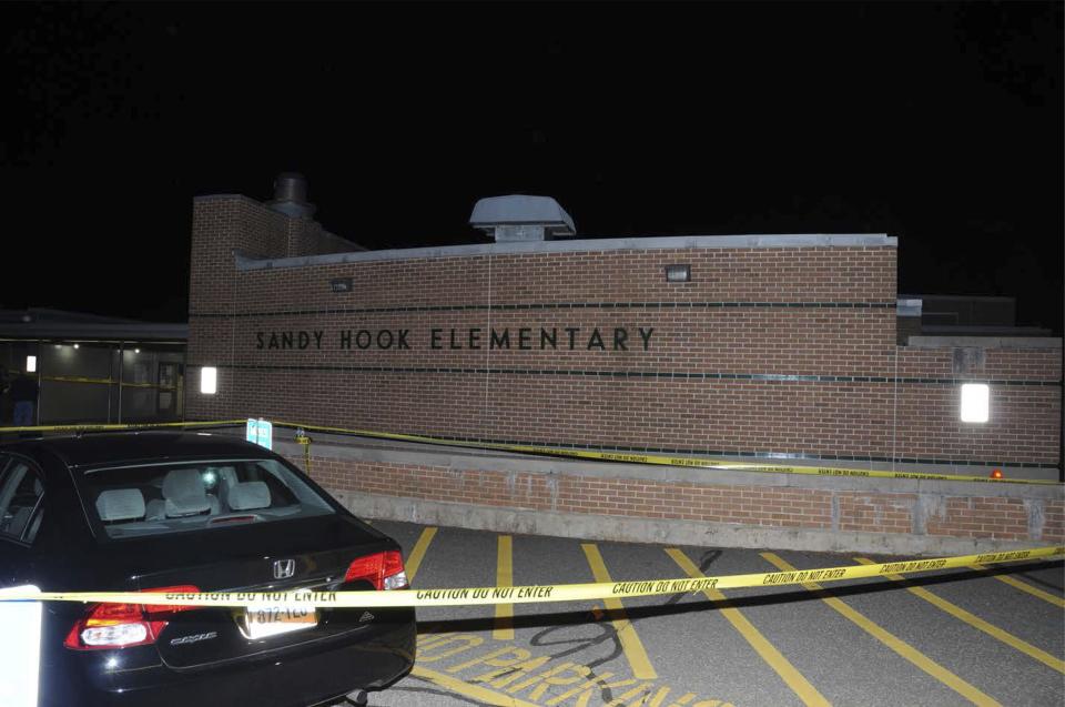 The car driven by Adam Lanza is pictured at Sandy Hook Elementary School in Newtown, Connecticut, in this evidence photo released by the Connecticut State Police, December 27, 2013. Connecticut state police released a trove of documents and video on Friday tied to their investigation of the massacre at Sandy Hook Elementary School last year that killed 20 children and six adults. REUTERS/Connecticut State Police/Handout via Reuters (UNITED STATES - Tags: CRIME LAW) ATTENTION EDITORS - FOR EDITORIAL USE ONLY. NOT FOR SALE FOR MARKETING OR ADVERTISING CAMPAIGNS. THIS IMAGE HAS BEEN SUPPLIED BY A THIRD PARTY. IT IS DISTRIBUTED, EXACTLY AS RECEIVED BY REUTERS, AS A SERVICE TO CLIENTS