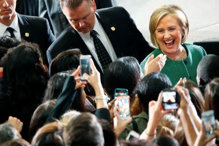 Former U.S. Secretary of State Hillary Clinton (R) greets supporters after a campaign rally for Maryland Lieutenant Governor Anthony Brown (not pictured), Democratic nominee for Maryland governor, at the University of Maryland in College Park, Maryland October 30, 2014. REUTERS/Jonathan Ernst