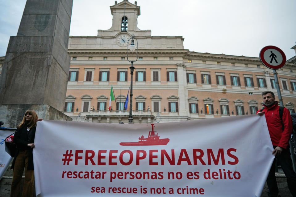 Protesters gather during a demonstration in support of German humanitarian group Sea-Watch, in front of the Italian lower chamber’s Montecitorio palace, in Rome, Monday, Jan. 28, 2019. A Sea-Watch rescue ship that picked up 47 migrants off the Libyan coasts on Jan. 19, was allowed to shelter in the Italian territorial waters due to threatening weather last Thursday, but the government refuses to let aid groups disembark the migrants in Italian ports. (AP Photo/Andrew Medichini)