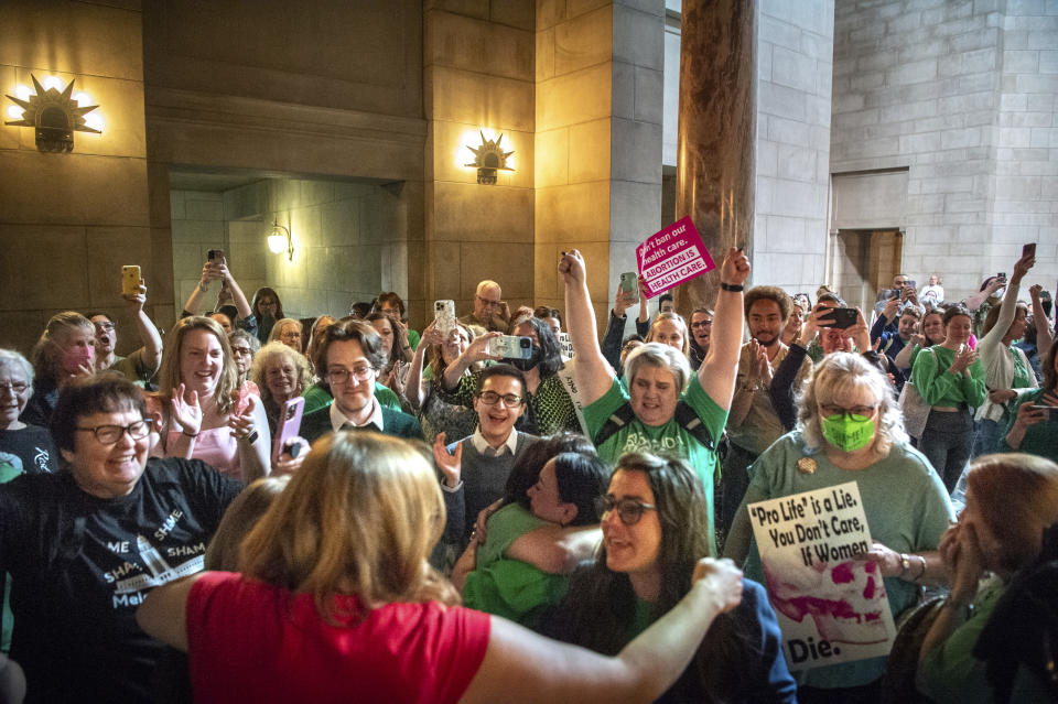 Opponents of LB626 celebrate in the Rotunda after the bill fails to advance after failing one vote short of cloture, Thursday, April 27, 2023, at the Nebraska State Capital in Lincoln, Neb. The bill sought to ban abortions in Nebraska after about 6 six weeks. (Larry Robinson/Lincoln Journal Star via AP)