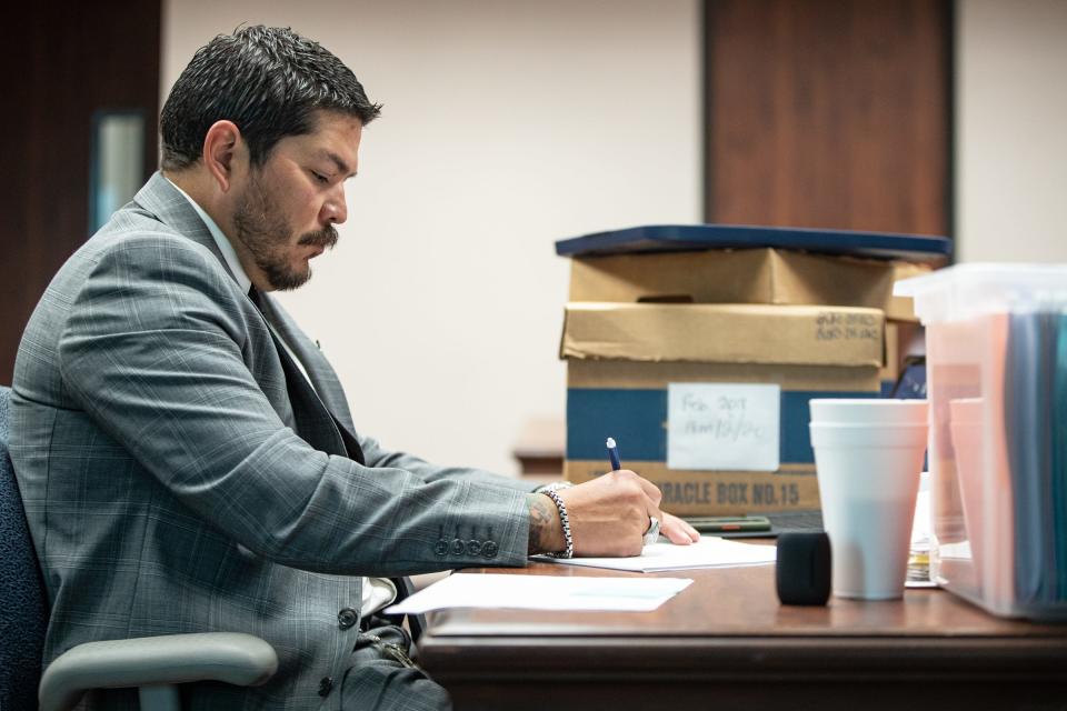 District Attorney Mark Gonzalez takes notes during a trial at the Nueces County Courthouse on Thursday, April 14, 2022.