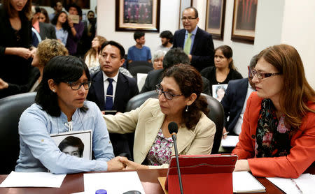 REFILE- CORRECTING TYPO Carmen Condor, sister of Amaro Condor, victim of repression amid the ruling of Alberto Fujimori, speaks with her representatives before a hearing convened by the judges of the Inter-American Court of Human Rights in San Jose, Costa Rica, February 2, 2018. REUTERS/Juan Carlos Ulate