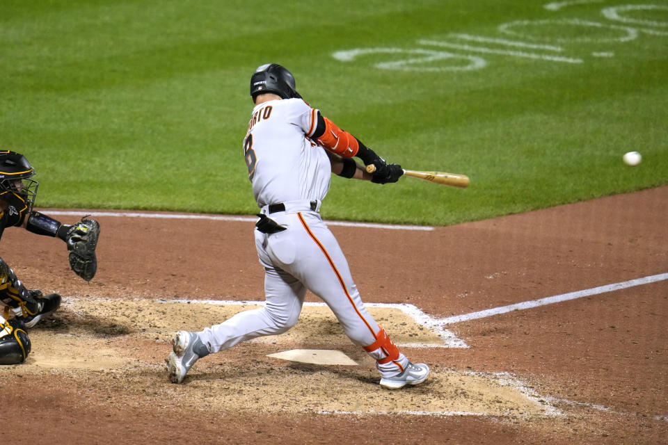 San Francisco Giants' Michael Conforto singles off Pittsburgh Pirates relief pitcher David Bednar, driving in two runs, during the eighth inning of a baseball game in Pittsburgh, Saturday, July 15, 2023. (AP Photo/Gene J. Puskar)