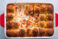 <p>It's worth it to sneak one pre-serving since they'll be gone before you can say "touchdown". </p><p>Get the <strong><a href="https://www.delish.com/cooking/recipe-ideas/a22708486/pull-apart-garlic-bread-pizza-dip-recipe/" rel="nofollow noopener" target="_blank" data-ylk="slk:Pull-Apart Garlic Bread Pizza Dip recipe;elm:context_link;itc:0;sec:content-canvas" class="link ">Pull-Apart Garlic Bread Pizza Dip recipe</a></strong> from Delish.</p>