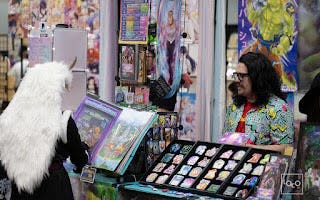 Comic con-goer explores vendor options at the 2023 Des Moines Con.
