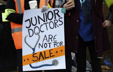 A placard that reads "Junior Doctors Are Not For Sale" is displayed during a strike outside St Thomas' Hospital in London, Britain February 10, 2016. REUTERS/Toby Melville