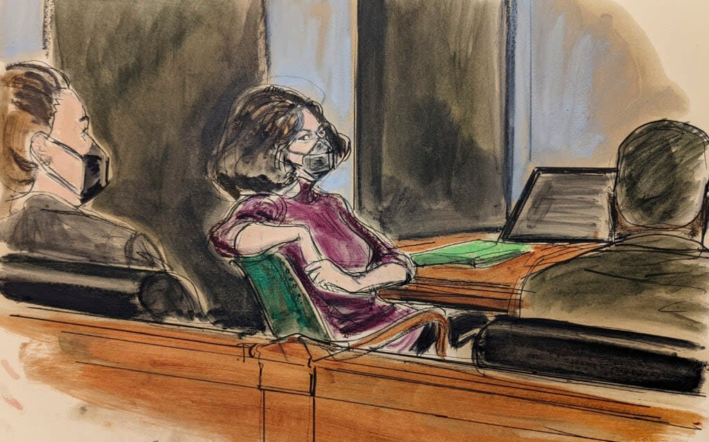 In this courtroom sketch, Ghislaine Maxwell, center, sits in the courtroom during a discussion about a note from the jury, during her sex trafficking trial, Wednesday, Dec. 29, 2021, in New York. (AP Photo/Elizabeth Williams)