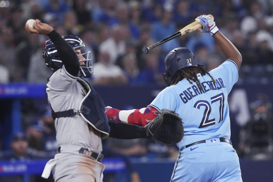 Toronto Blue Jays' Vladimir Guerrero Jr. reacts after striking out, next to New York Yankees catcher Jose Trevino during the fourth inning of a baseball game Tuesday, May 16, 2023, in Toronto. (Chris Young/The Canadian Press via AP)