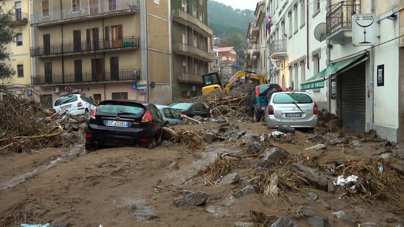 Still image taken from video shows cars submerged from flash floods in Bitti