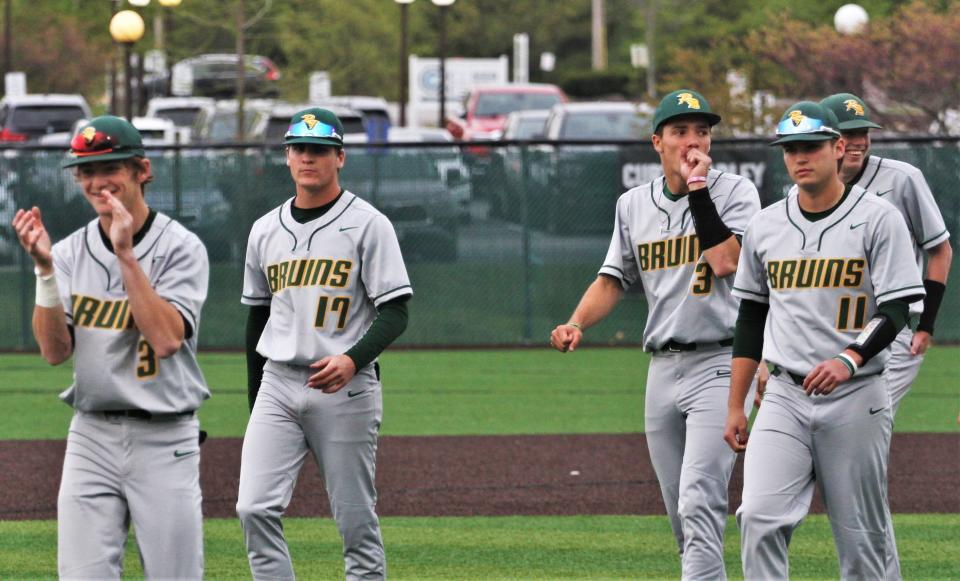 The Rock Bridge baseball team walks off after defeating Battle 5-0 on April 26, 2023, in Columbia, Mo.