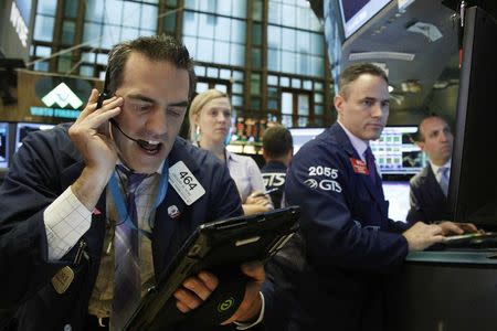 Traders work on the floor of the New York Stock Exchange (NYSE) in New York City, U.S., May 2, 2016. REUTERS/Brendan McDermid