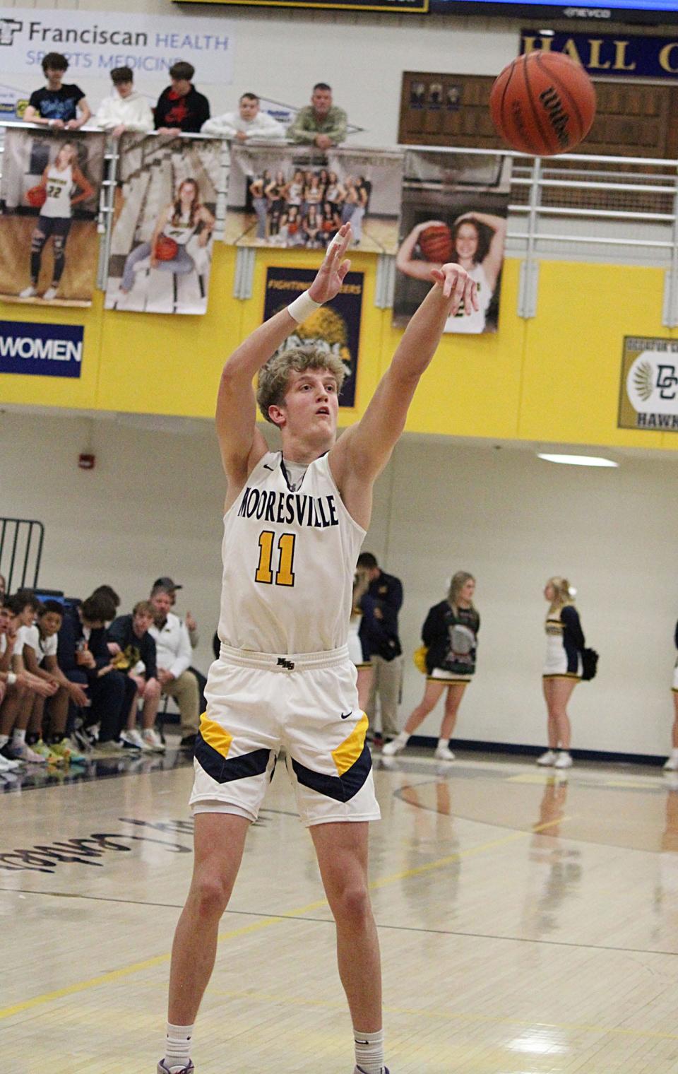 Mooresville junior Wes Reeves launches a shot during Friday's Mid-State Conference game against Decatur Central. 