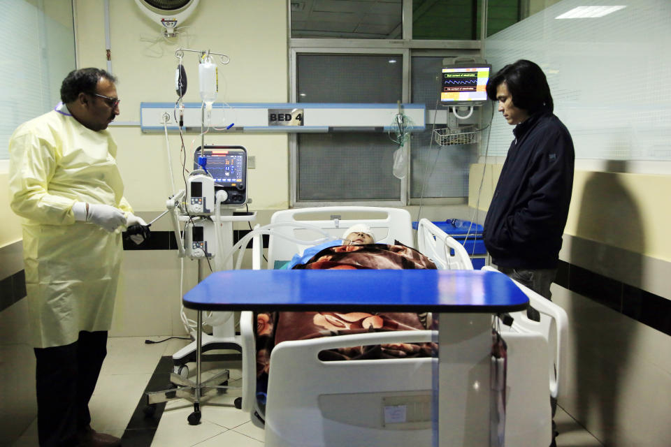 An Afghan receives treatment at hospital after suicide attack in Kabul, Afghanistan, Saturday, Oct. 24, 2020. The death toll from the suicide attack Saturday in Afghanistan's capital has risen that includes schoolchildren, the interior ministry said.. (AP Photo/Mariam Zuhaib)