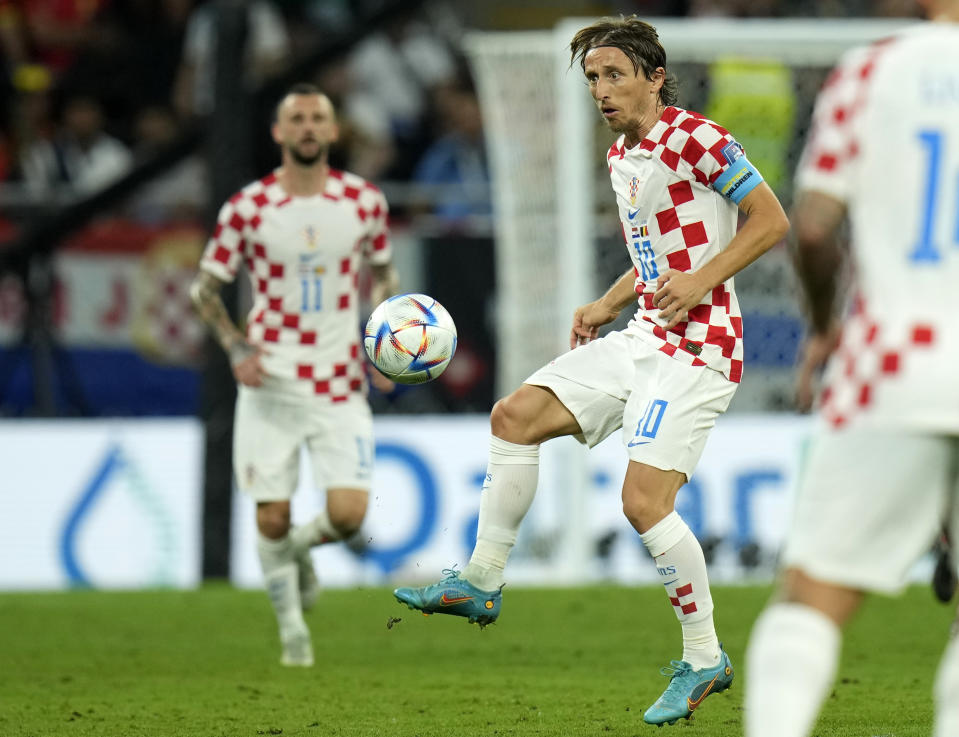 Croatia's Luka Modric, center, kicks the ball during the World Cup group F soccer match between Croatia and Belgium at the Ahmad Bin Ali Stadium in Al Rayyan, Qatar, Thursday, Dec. 1, 2022. (AP Photo/Francisco Seco)