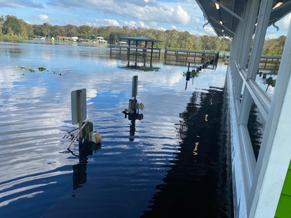 Docks are covered by even more water at Drifters Riverfront Bar and Grill in Astor. Lake County has closed its ramps at Butler Street, Pearl Street and Lake George.