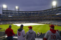 Fans arrive for Game 3 of baseball's World Series between the Houston Astros and the Philadelphia Phillies on Monday, Oct. 31, 2022, in Philadelphia. The game was postponed by rain Monday night with the matchup tied 1-1. (AP Photo/Matt Rourke)