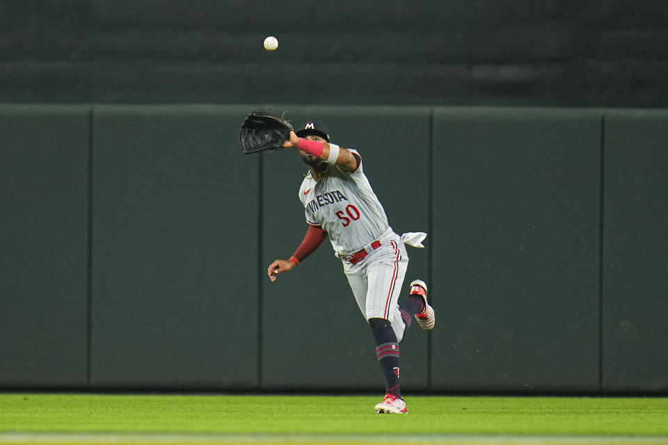 Minnesota Twins center fielder Willi Castro makes a catch against the Baltimore Orioles during the fifth inning of a baseball game, Friday, June 30, 2023, in Baltimore. (AP Photo/Julio Cortez)