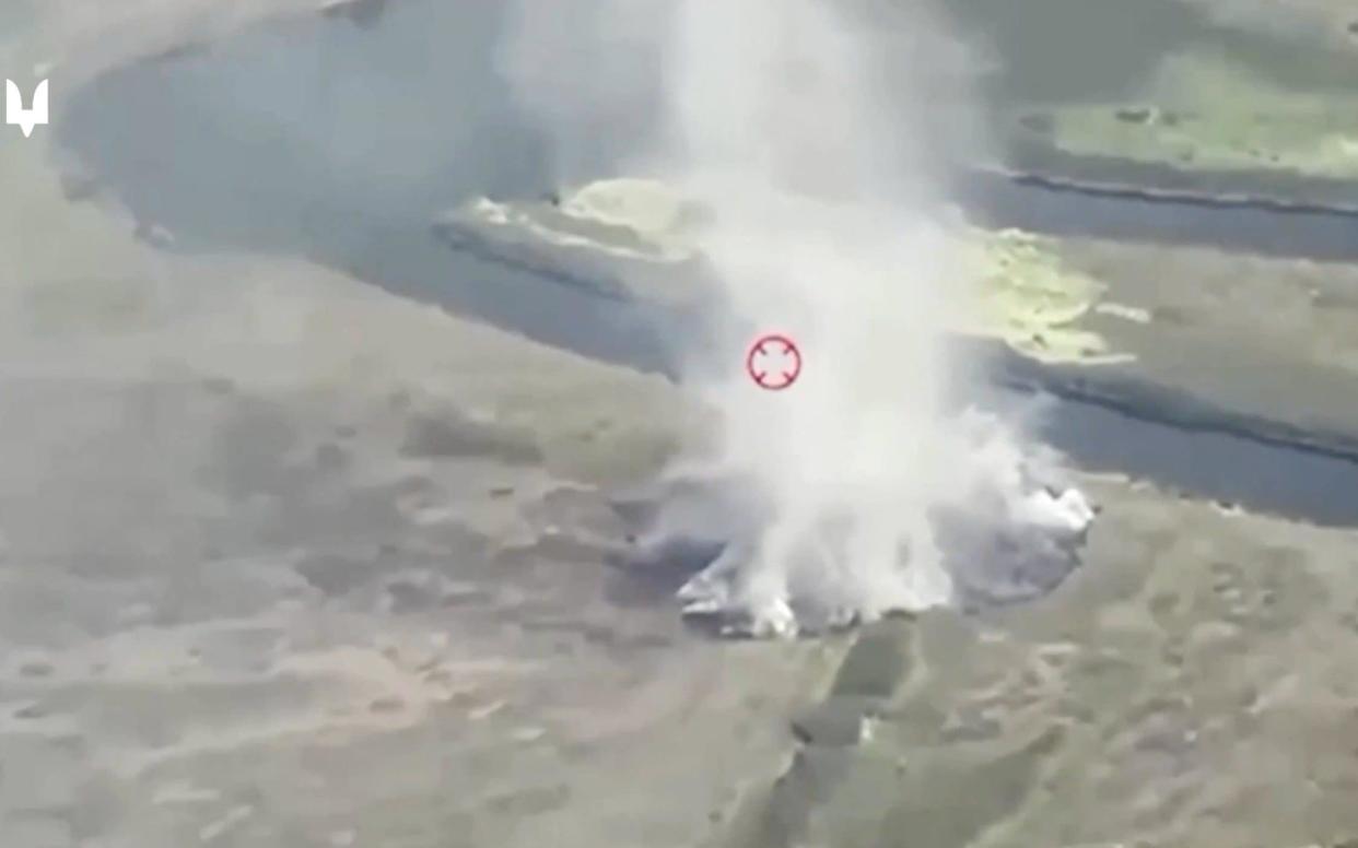 Drone footage shows smoke rising after strikes on pontoon crossings over the River Seym