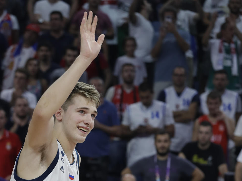 Luka Doncic waves to the fans after Slovenia won its first ever EuroBasket title. (AP)