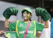 A young Pakistani fan shows her muscles before South Africa's Cricket World Cup match against Pakistan in Auckland, March 7, 2015. REUTERS/Nigel Marple