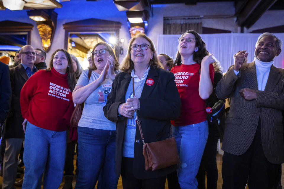 Supporters of former U.S. Rep. Tom Suozzi, Democratic candidate for New York's 3rd congressional district, cheer while watching live updates at his election night party Tuesday, Feb. 13, 2024, in Woodbury, N.Y. (AP Photo/Stefan Jeremiah)