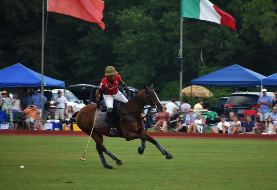 The crowd watches as Newport takes on New York in a polo match in Portsmouth.