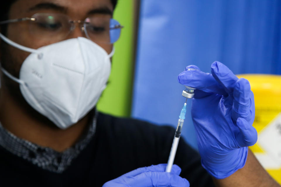 A healthcare worker prepares a dose of Pfizer, coronavirus (Covid-19) vaccine at a vaccination centre in London. (Photo by Dinendra Haria / SOPA Images/Sipa USA)