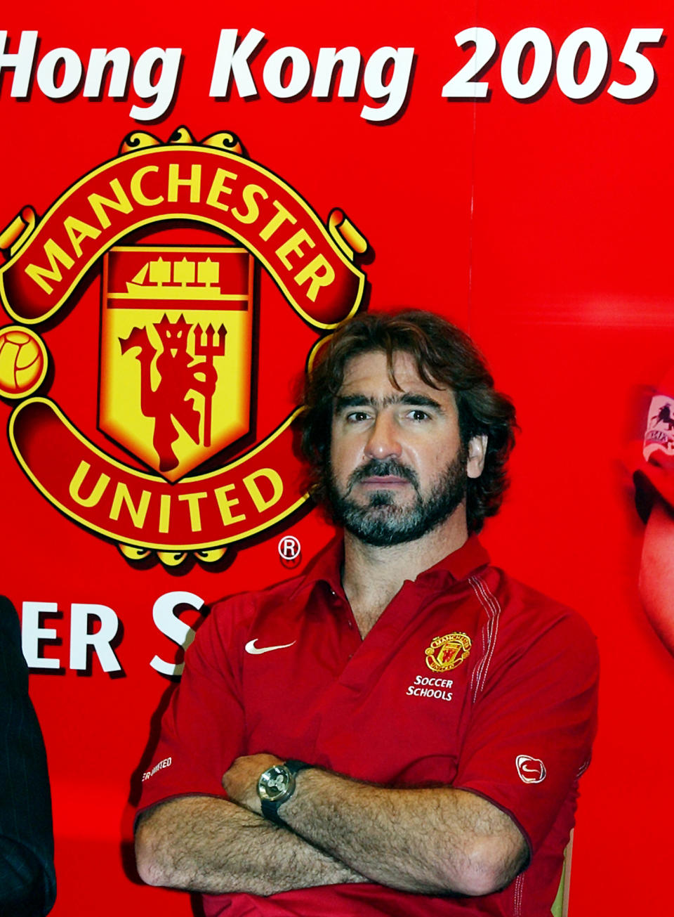 Former captain of Manchester United soccer team Eric Cantona attends at a news conference in Hong Kong, Wednesday, July 20, 2005. Cantona is in the territory to promote Manchester United Soccer School in Hong Kong. (AP Photo/Lo Sai Hung)