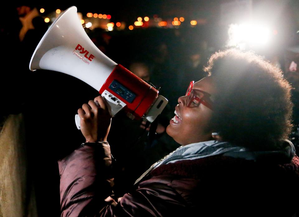 Amber Sherman speaks into a megaphone as demonstrators block traffic on I-55 at the Memphis-Arkansas Bridge as they protest the killing of Tyre Nichols on Friday, Jan. 27, 2023, in Memphis, Tenn. 