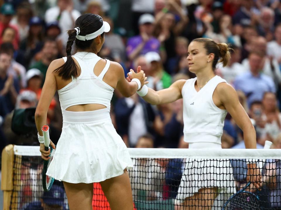 Raducanu shakes hands with Sakkari after knocking out the world No 9 (Reuters)