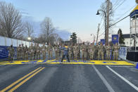 Boston Marathon Race Director Dave McGillivray, centre, sends a group of Massachusetts National Guard members across the start line in Hopkinton on Monday, April 15, 2024 to begin the marathon. The start line was painted in honor of the town that has hosted the marathon for the past century. It's the 128th edition of the world’s oldest and most prestigious annual marathon. (AP Photo/Jennifer McDermott)