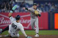 Oakland Athletics shortstop Nick Allen throws to first base for the double play after forcing out New York Yankees' Aaron Judge (99) during the first inning of a baseball game Thursday, April 25, 2024, in New York. Anthony Rizzo was out at first. (AP Photo/Bryan Woolston)