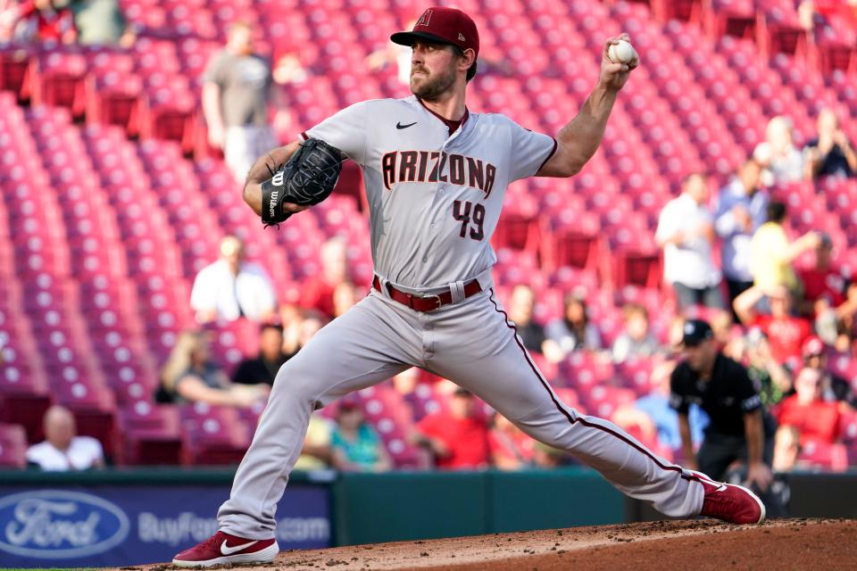 Arizona Diamondbacks starting pitcher Tyler Gilbert throws during the first inning of the team's baseball game against the Cincinnati Reds Tuesday, June 7, 2022, in Cincinnati. (AP Photo/Jeff Dean)