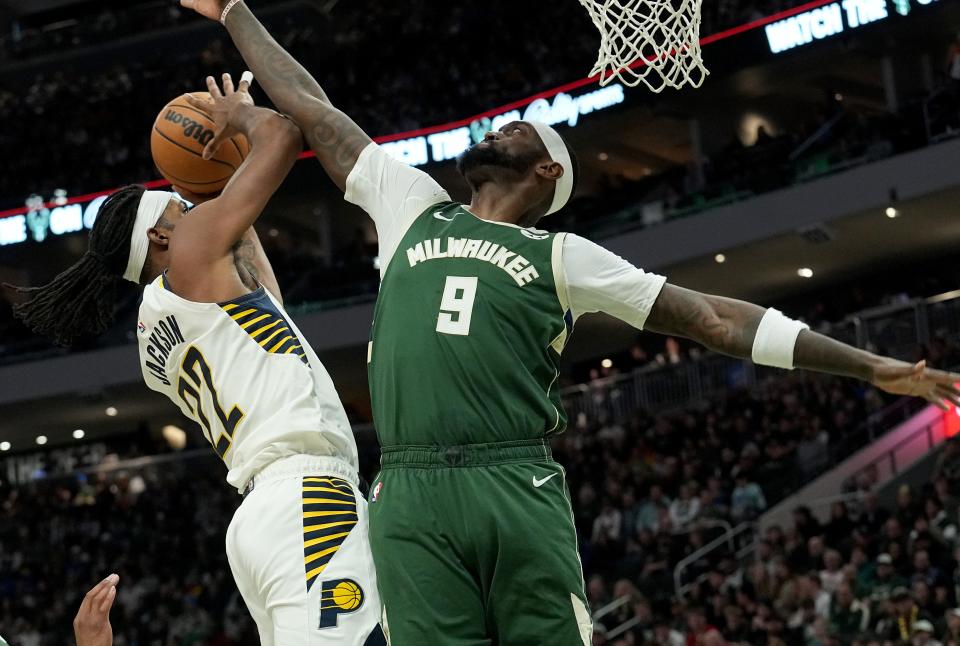 Milwaukee Bucks forward Bobby Portis (9) thwarts a shot by Indiana Pacers forward Isaiah Jackson (22) during the first half of their game Monday, January 1, 2024 at Fiserv Forum in Milwaukee, Wisconsin.